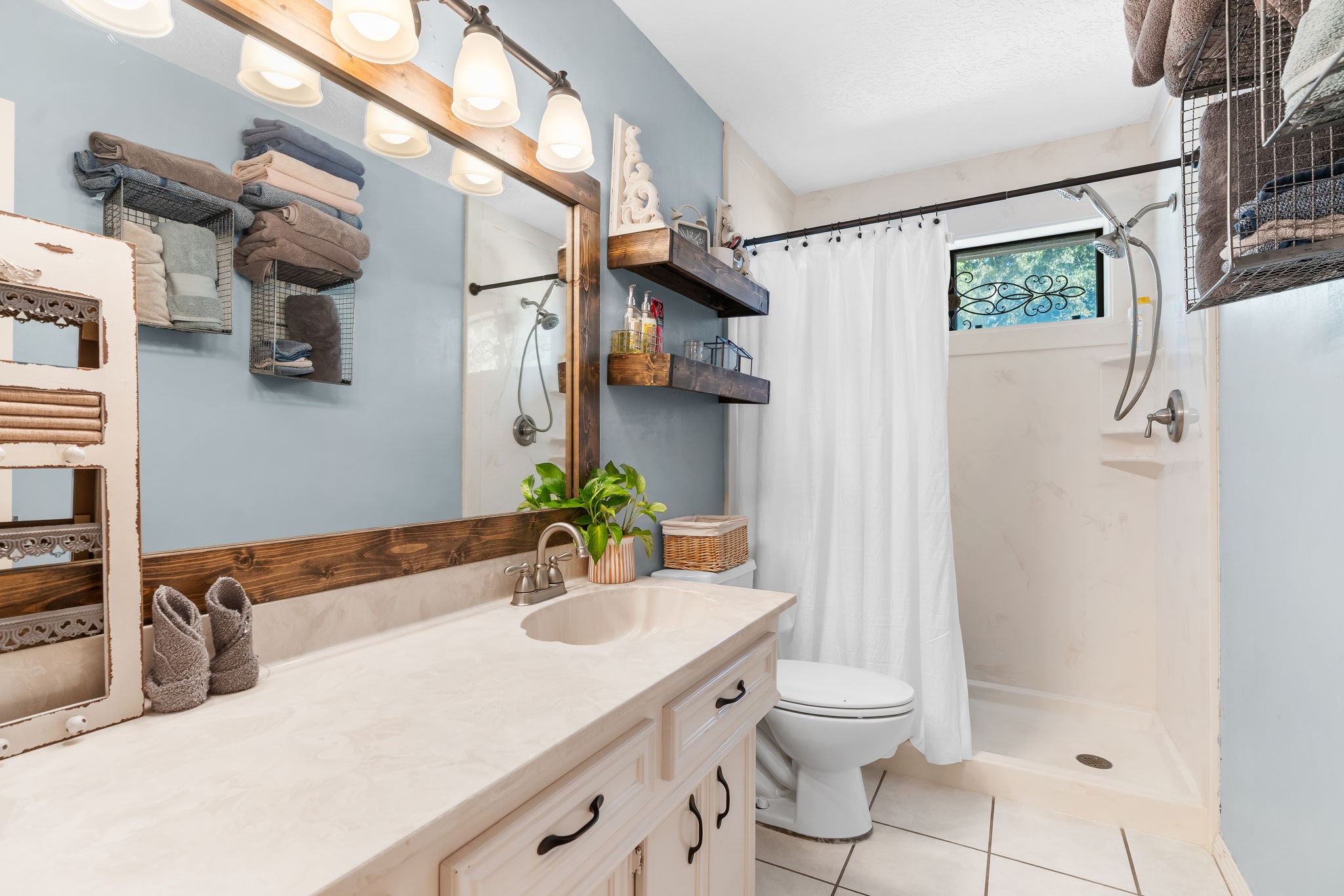 6971 Breezy Point Willis, TX 77318 - Photo 22 of 49 a bathroom with a granite countertop sink toilet and shower