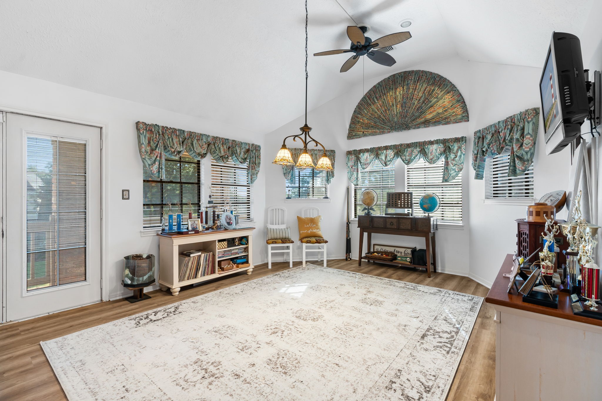 6971 Breezy Point Willis, TX 77318 - Photo 23 of 49 a view of a livingroom with furniture and a flat screen tv