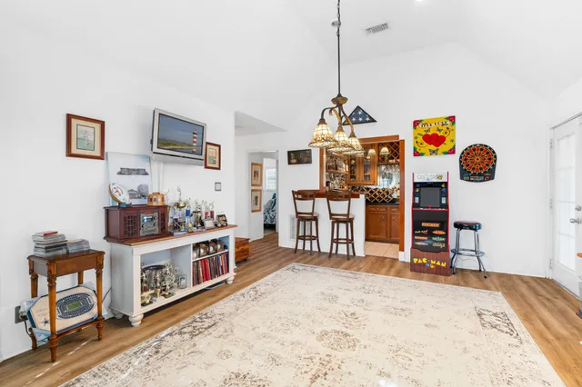 a view of a livingroom with furniture and a flat screen tv