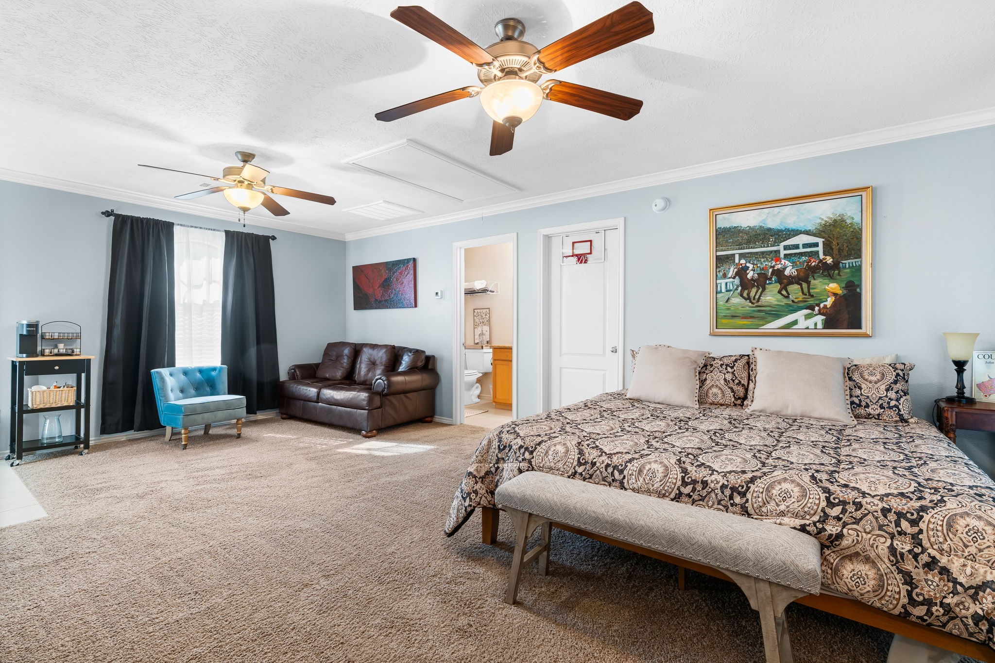6971 Breezy Point Willis, TX 77318 - Photo 29 of 49 a bedroom with a bed furniture and a ceiling fan