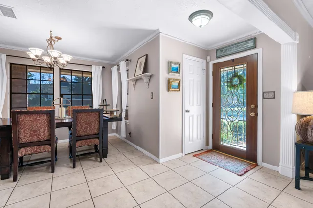 a view of a livingroom with furniture and a window