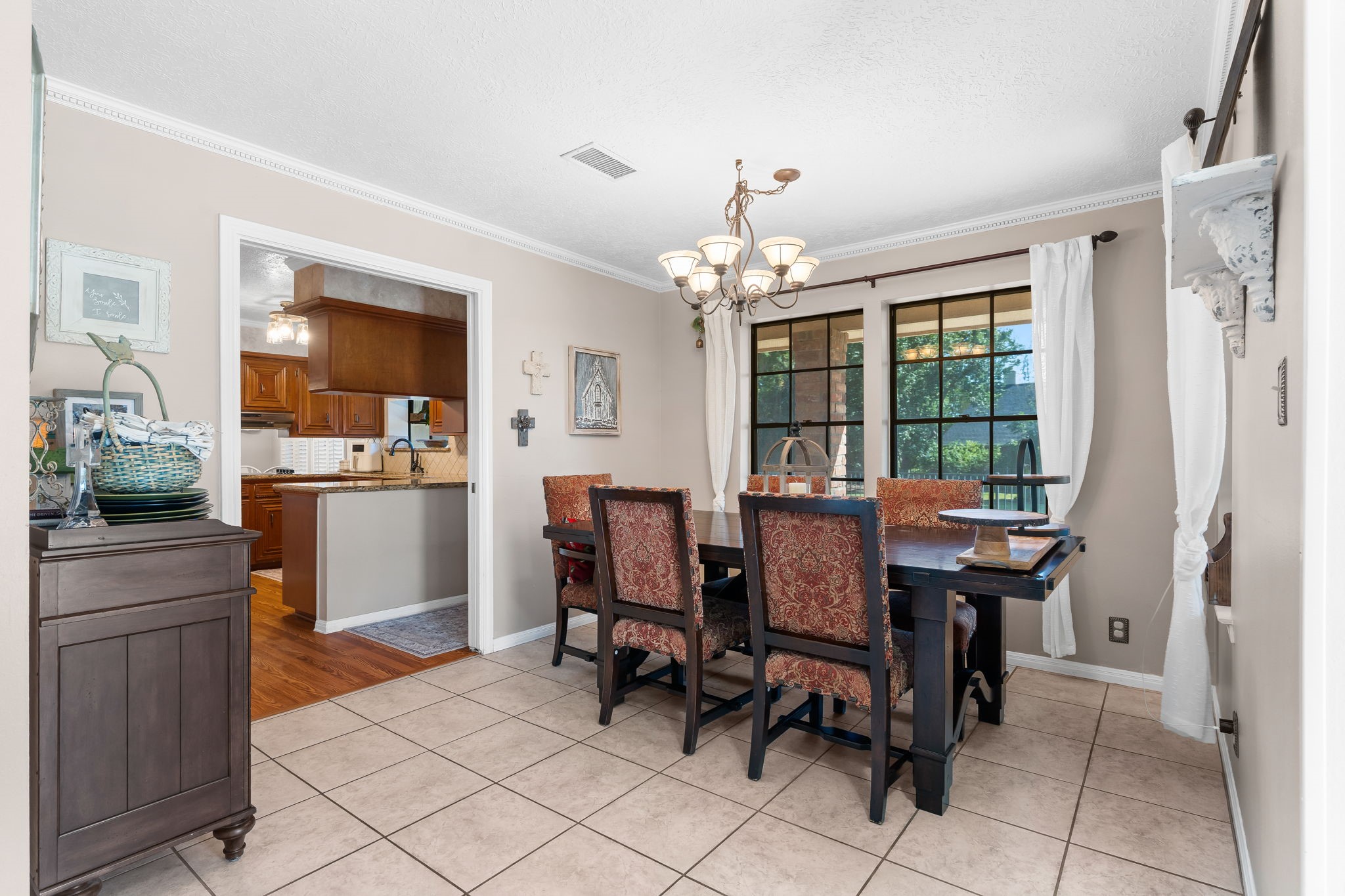 6971 Breezy Point Willis, TX 77318 - Photo 4 of 49 a view of a dining room with furniture and chandelier