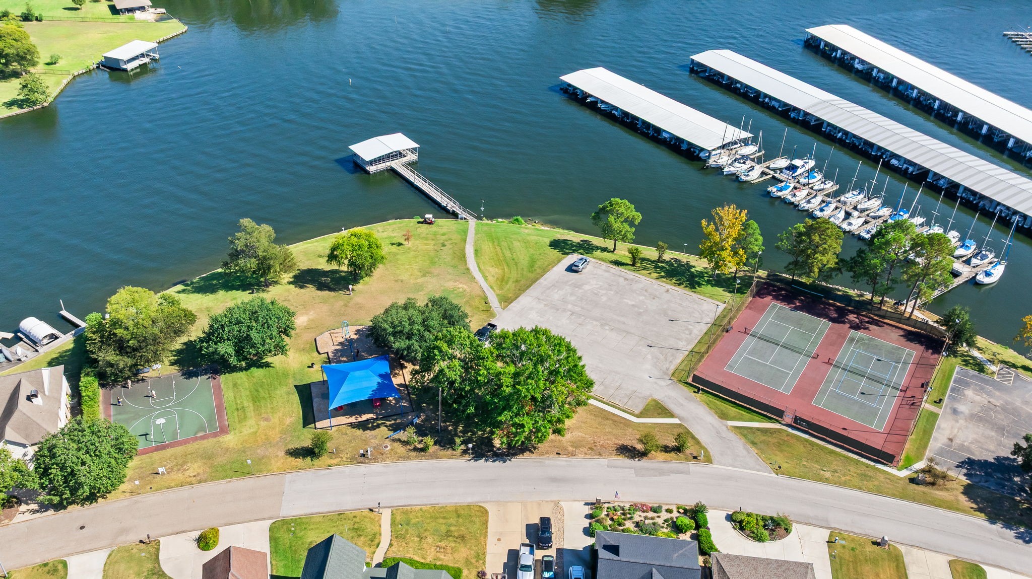 6971 Breezy Point Willis, TX 77318 - Photo 45 of 49 an aerial view of a house a yard swimming pool and outdoor seating