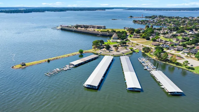 an aerial view of a house with a lake view