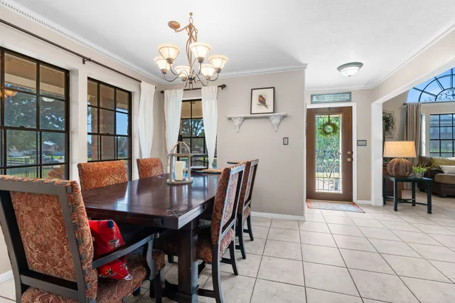 an aerial view of a house with a swimming pool