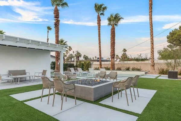 a view of a patio with couches table and chairs
