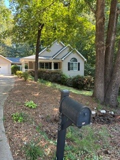 203 Indian Trail Road Seneca, SC 29672 - Photo 1 of 14 Mature trees frame a welcoming front porch and classic siding on this charming home.