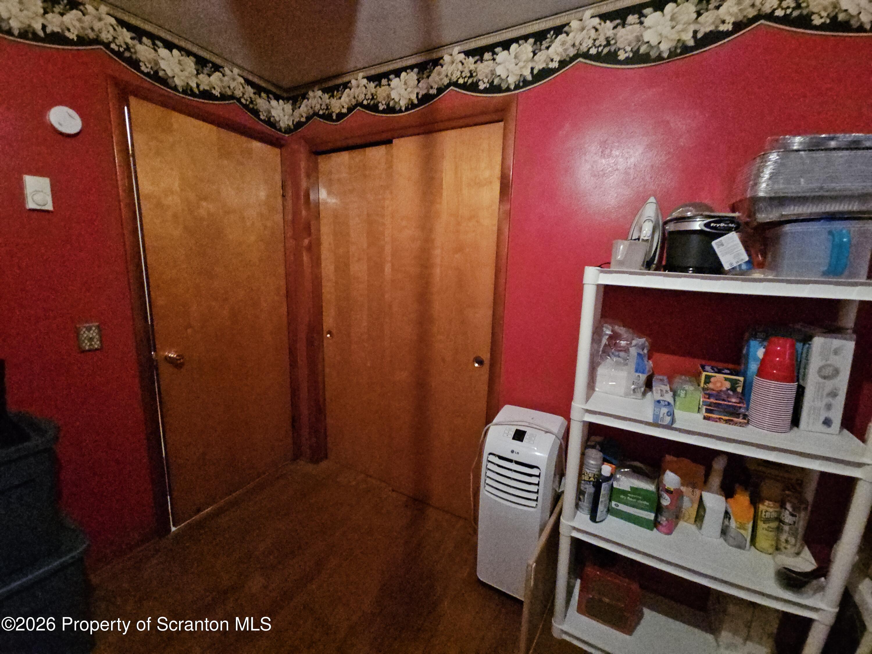405 Baker Street Taylor, PA 18517 - Photo 21 of 36 a bedroom with a bed and a dresser