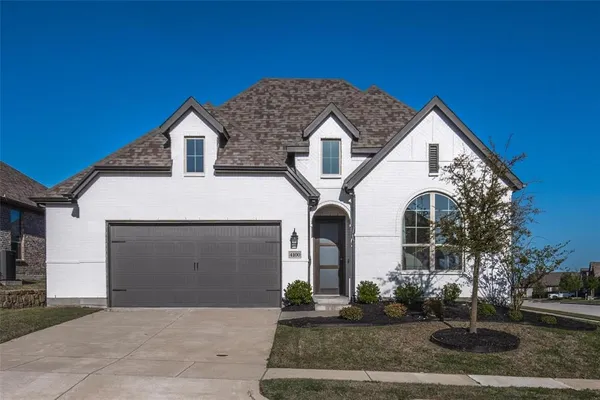 a front view of a house with garage