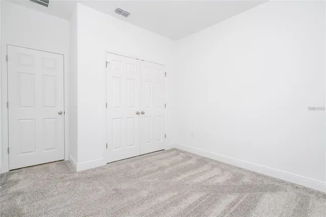 a view of a room that has a window in it