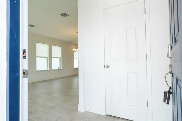 a view of hallway with windows