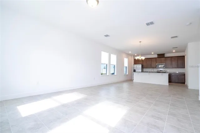 a view of a kitchen with a sink and cabinets