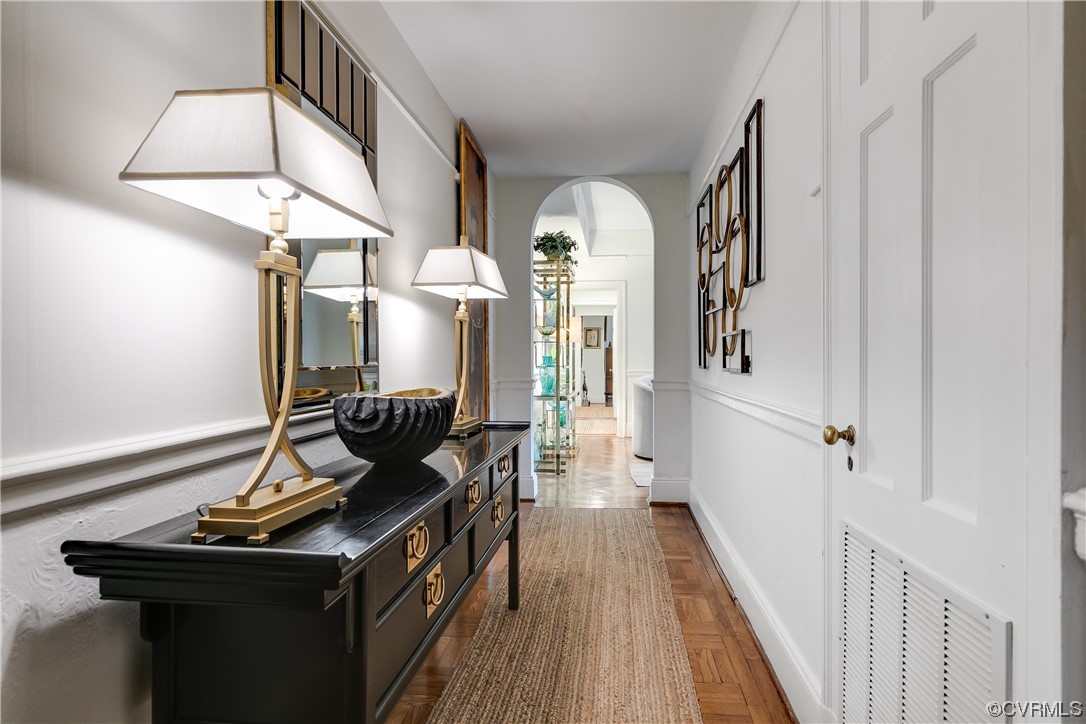 5621 Cary Street Road, Unit U206 Richmond, VA 23226 - Photo 5 of 34 a view of a hallway with wooden floor and staircase