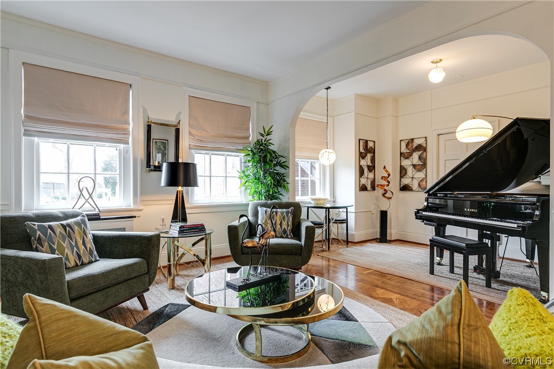 5621 Cary Street Road, Unit U206 Richmond, VA 23226 - Photo 7 of 34 a living room with furniture a wooden floor and a large window