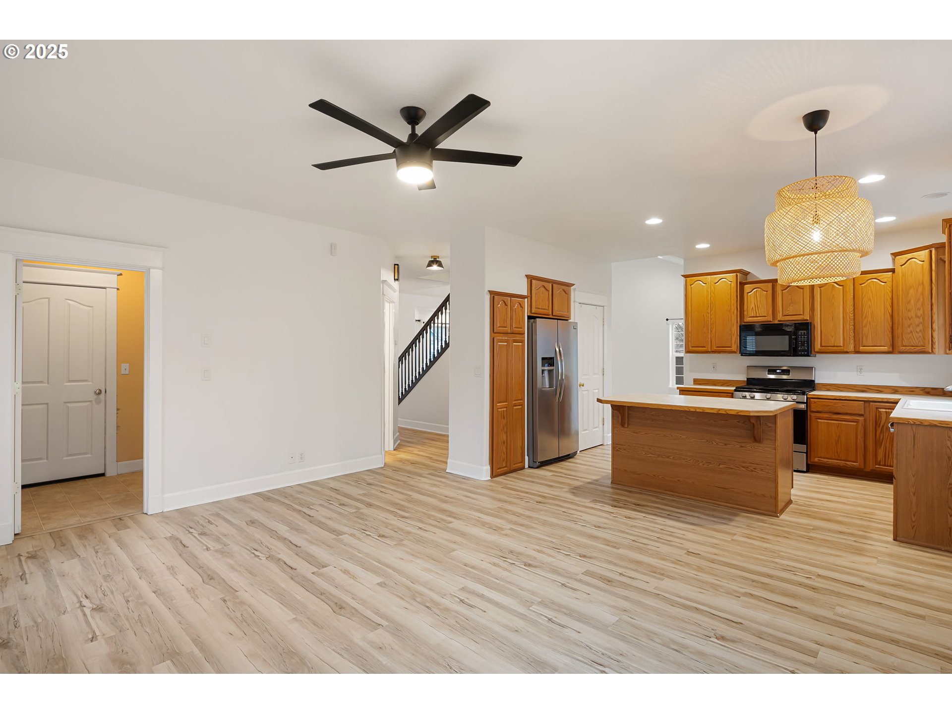 6808 Moses Pass Springfield, OR 97478 - Photo 16 of 37 a view of kitchen with cabinets and wooden floor