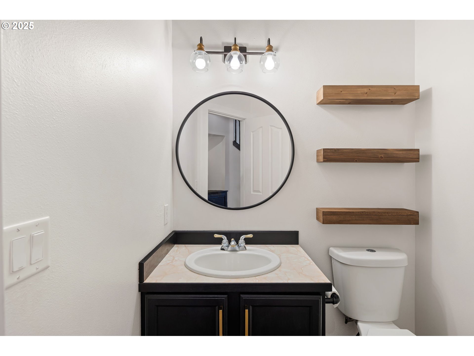 6808 Moses Pass Springfield, OR 97478 - Photo 19 of 37 a bathroom with a sink a toilet and a mirror