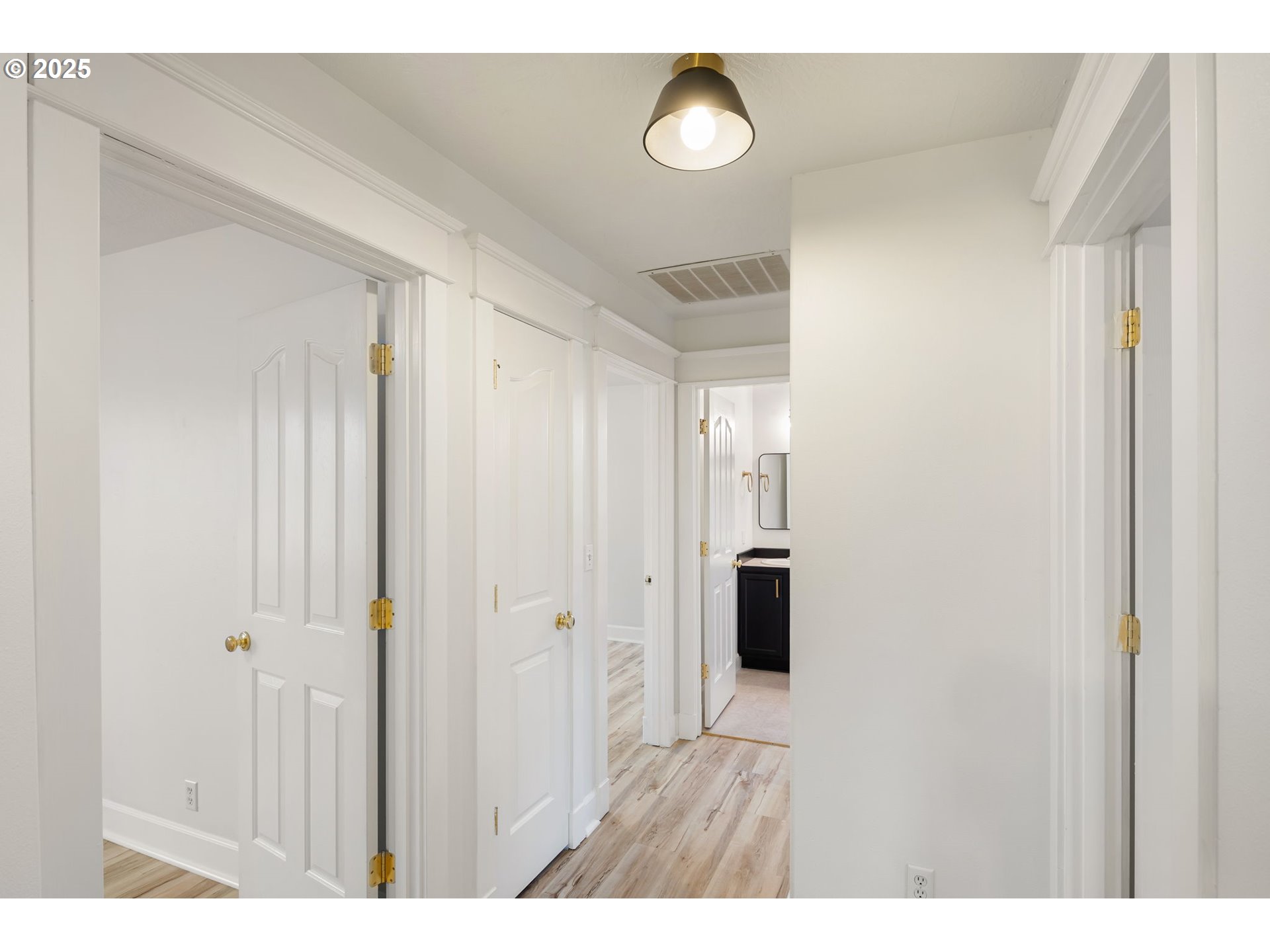 6808 Moses Pass Springfield, OR 97478 - Photo 21 of 37 a view of an empty room with wooden floor