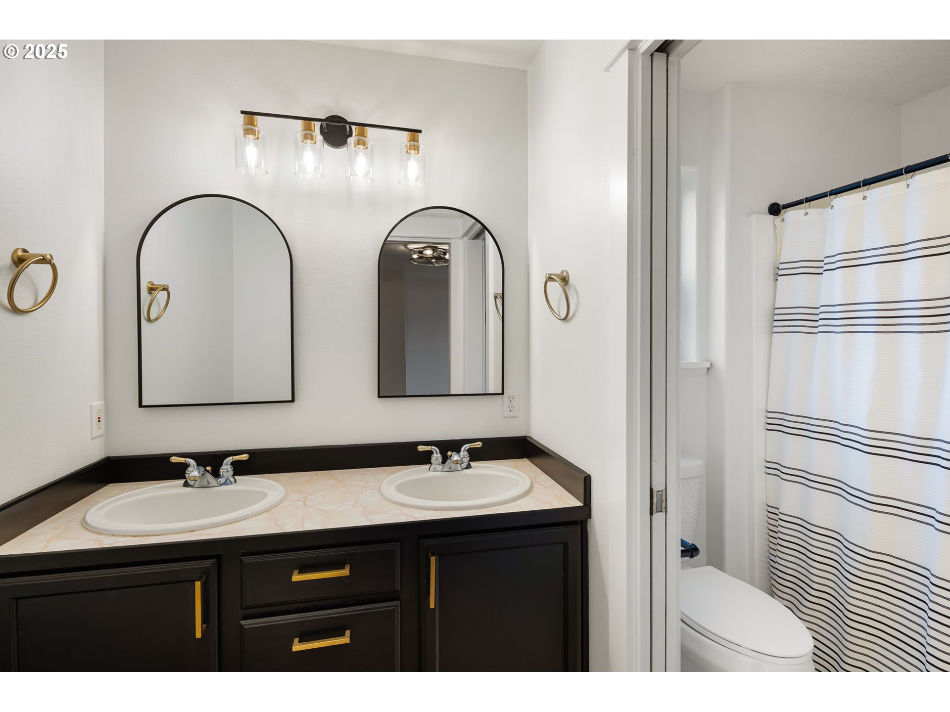 6808 Moses Pass Springfield, OR 97478 - Photo 25 of 37 a bathroom with a double vanity sink and a mirror