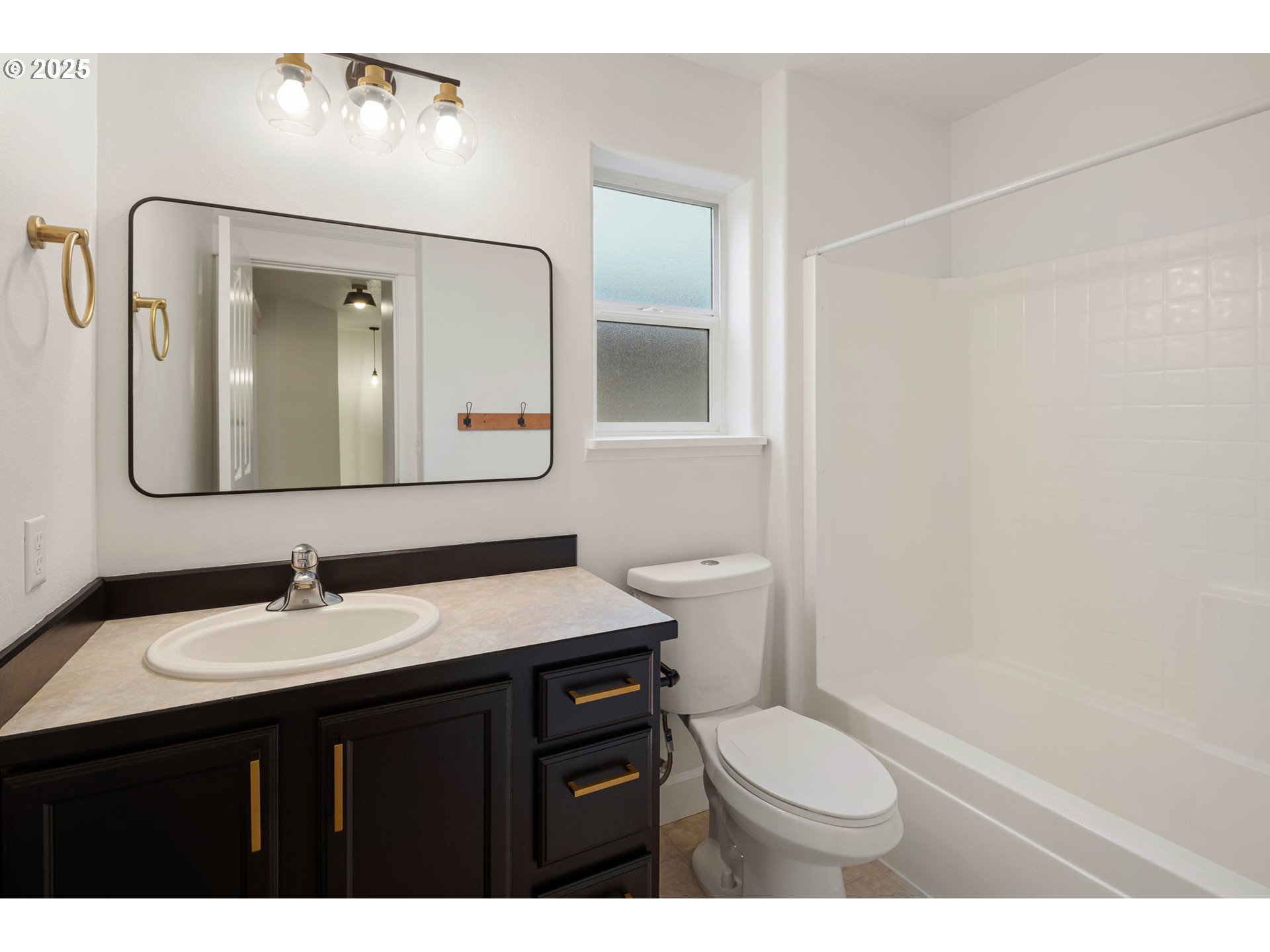 6808 Moses Pass Springfield, OR 97478 - Photo 30 of 37 a bathroom with a toilet a sink and mirror