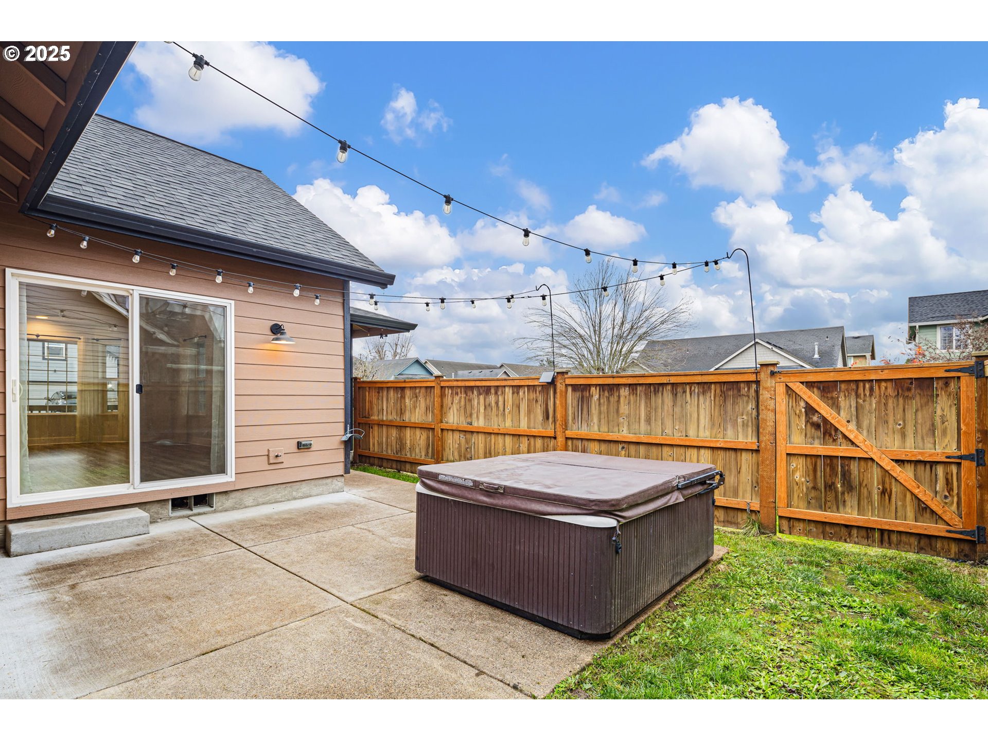 6808 Moses Pass Springfield, OR 97478 - Photo 34 of 37 a living room with furniture a rug and a chandelier