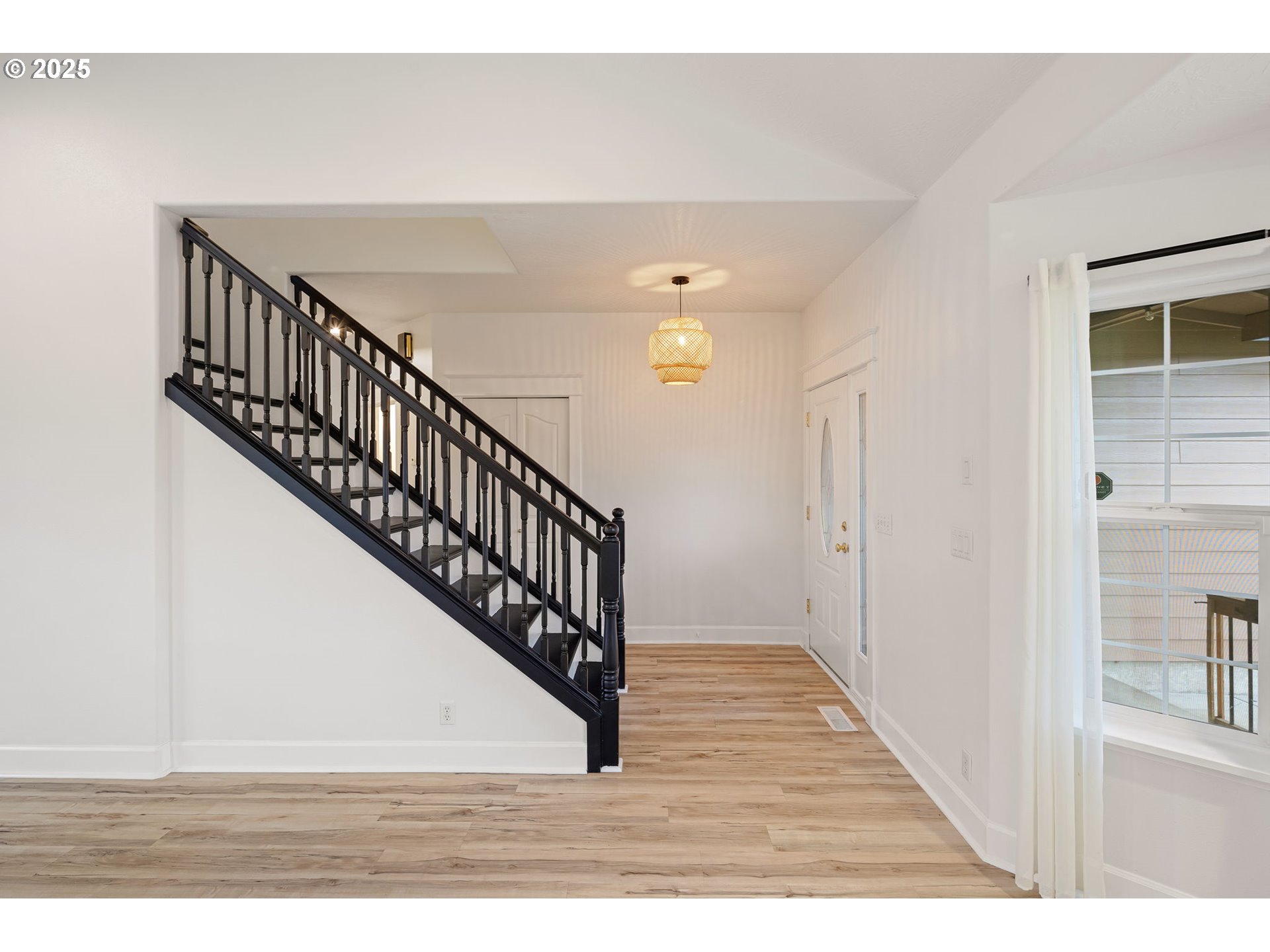 6808 Moses Pass Springfield, OR 97478 - Photo 5 of 37 a view of a hallway with wooden floor and stairs