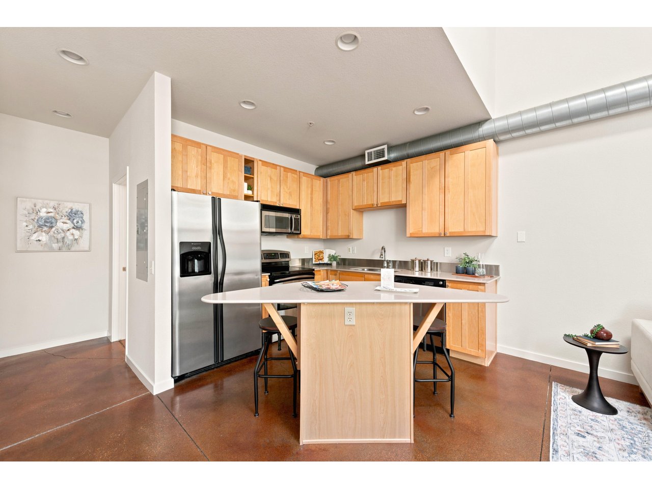 3033 Blake Street, Unit 112 Denver, CO 80205 - Photo 16 of 28 a kitchen with stainless steel appliances a stove a refrigerator white cabinets and wooden floor