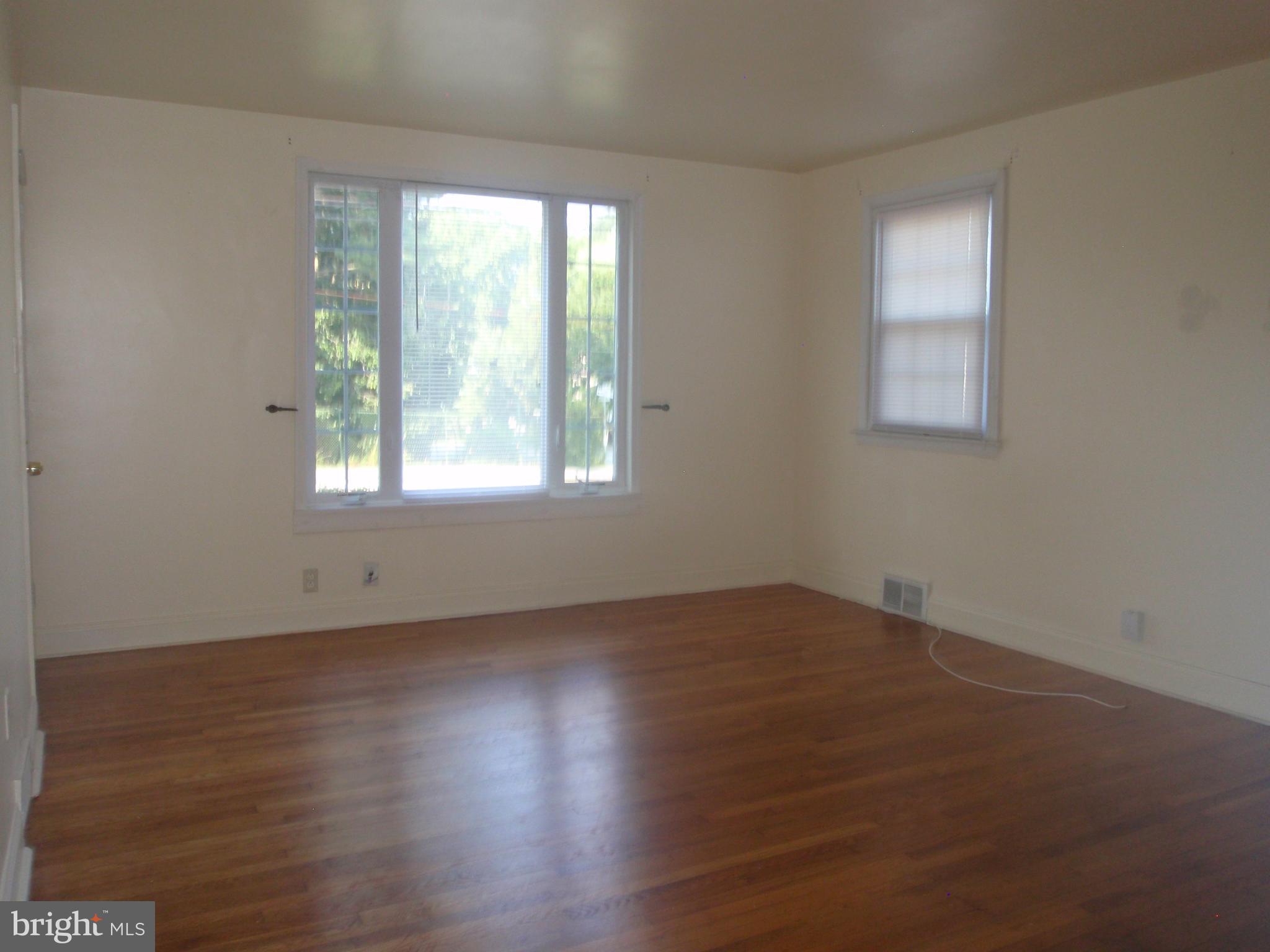 100 Moore Road Wallingford, PA 19086 - Photo 2 of 14 Beautiful hardwood flooring - spacious living room