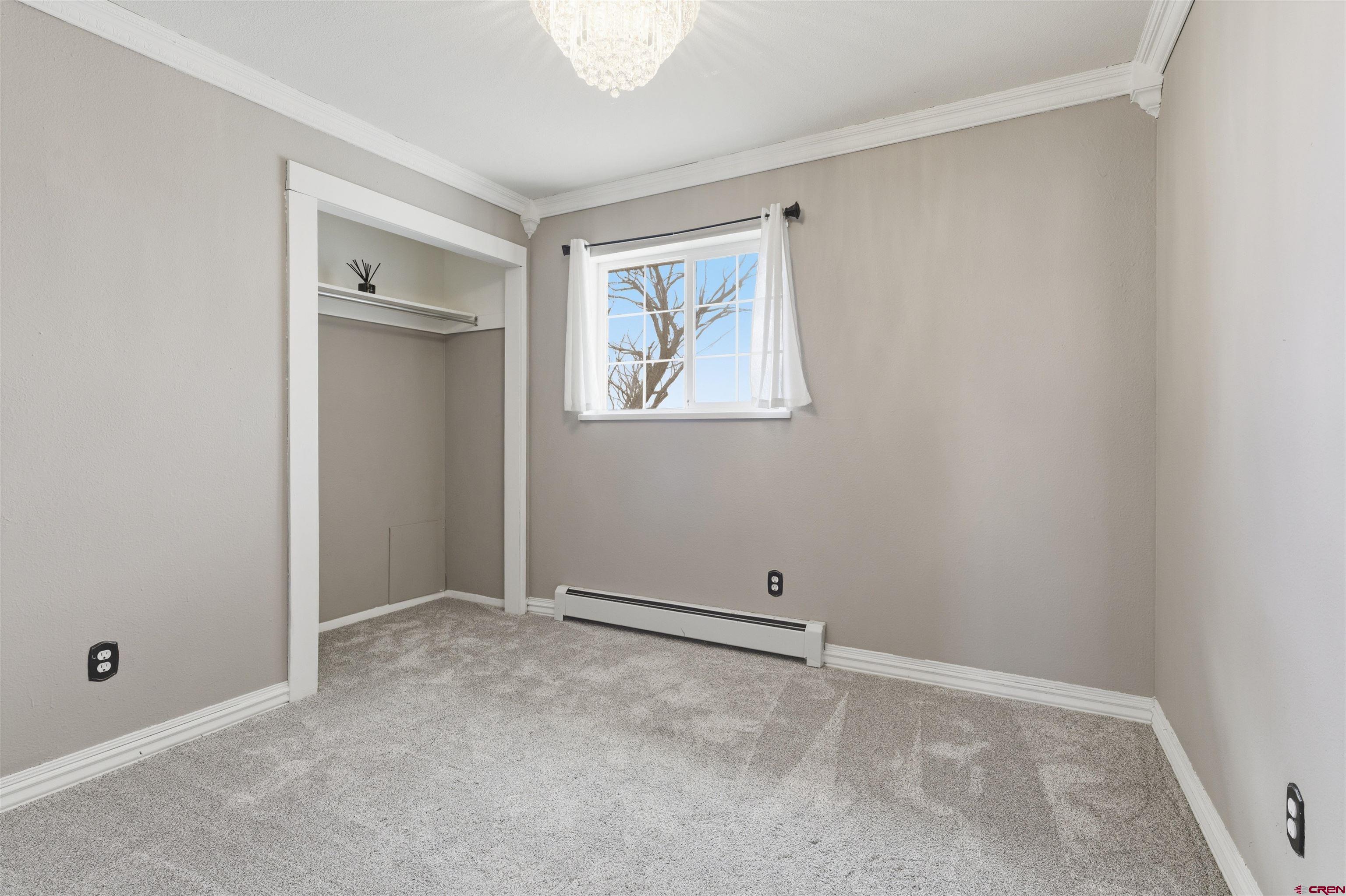 16216 2600th Road Cedaredge, CO 81413 - Photo 16 of 45 an empty room with windows