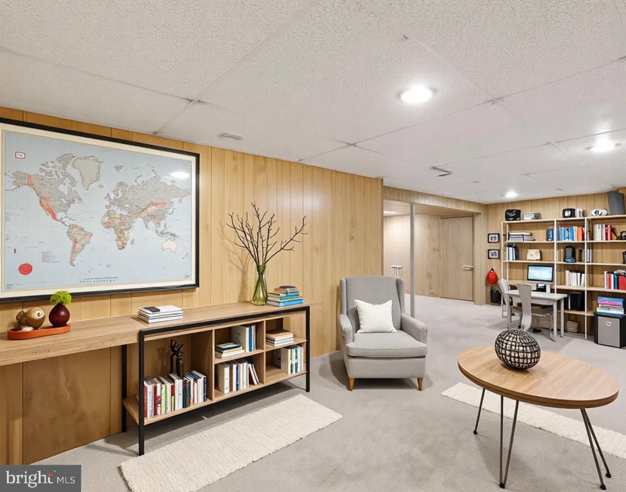 6372 Shadowshape Place Columbia, MD 21045 - Photo 30 of 36 a living room with furniture and book shelf