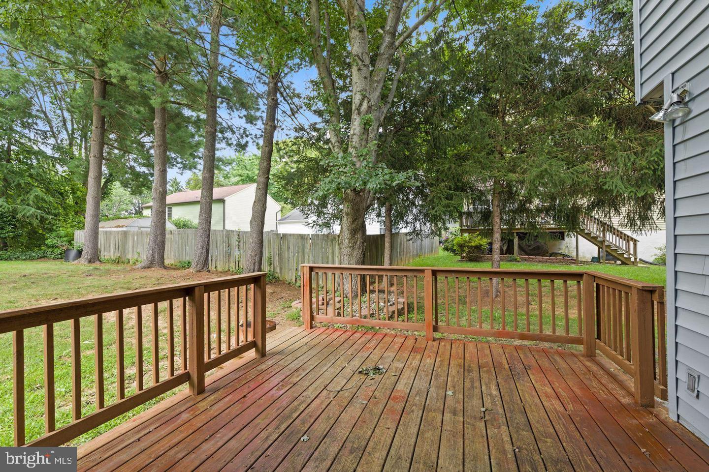 6372 Shadowshape Place Columbia, MD 21045 - Photo 34 of 36 a view of balcony with wooden floor and fence