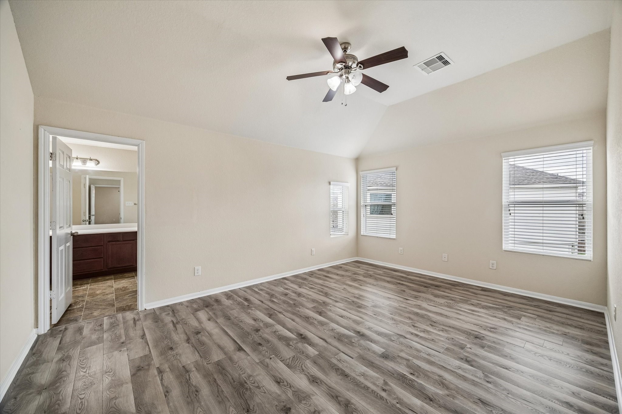 15642 South Fall Fern Circle Houston, TX 77044 - Photo 19 of 32 a view of empty room with wooden floor and fan