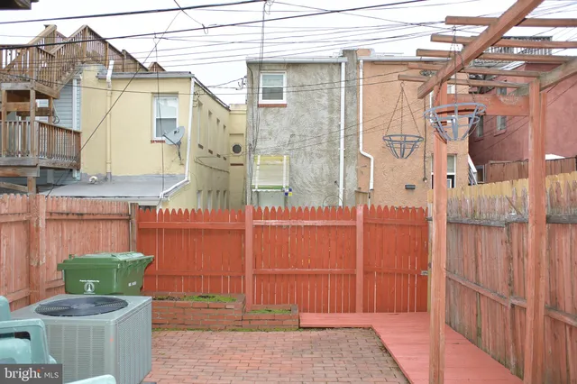 a view of a brick house with many windows