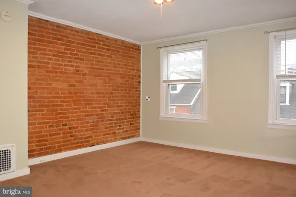 a view of an empty room with a window