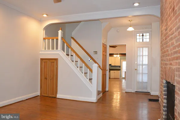 a view of an entryway with wooden floor