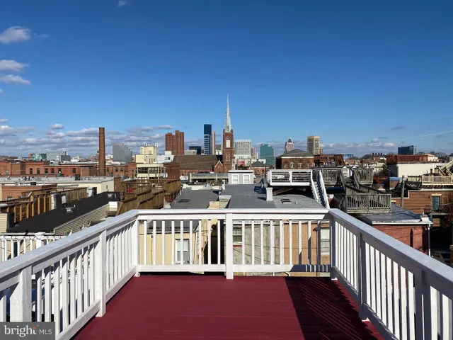 a view of a balcony with city