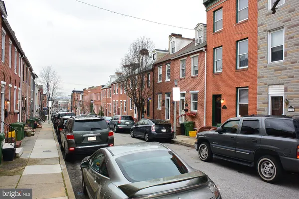a car parked in front of a buildings