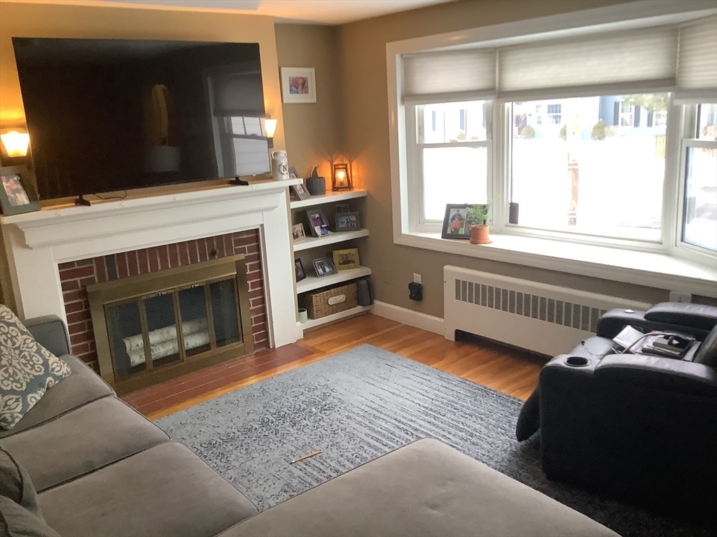 2 Chapel Road Danvers, MA 01923 - Photo 7 of 15 a living room with furniture and a fireplace