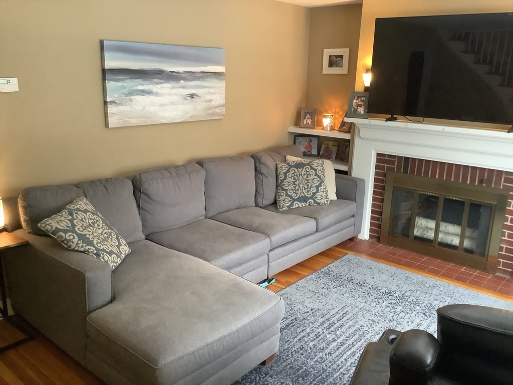 2 Chapel Road Danvers, MA 01923 - Photo 8 of 15 a living room with furniture and a fireplace