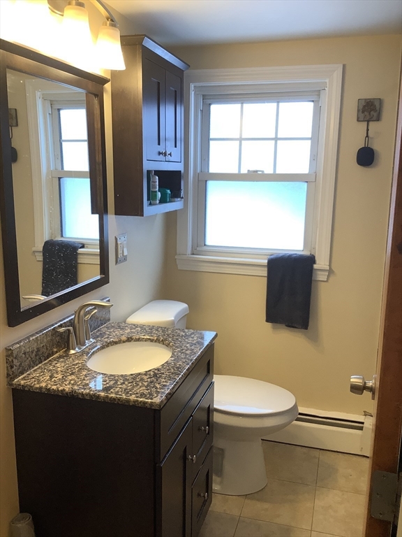 2 Chapel Road Danvers, MA 01923 - Photo 10 of 15 a bathroom with a granite countertop toilet sink and mirror
