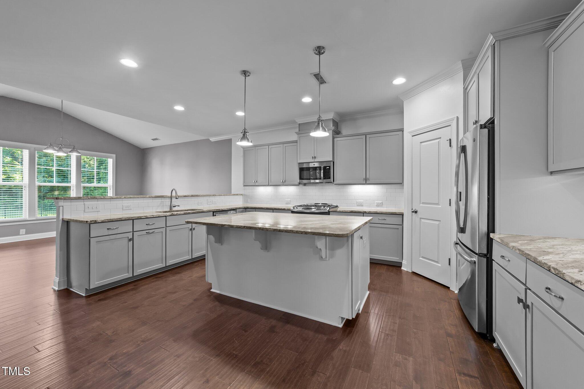 4125 Olde Judd Drive Willow Spring, NC 27592 - Photo 11 of 48 a kitchen with a refrigerator sink and cabinets