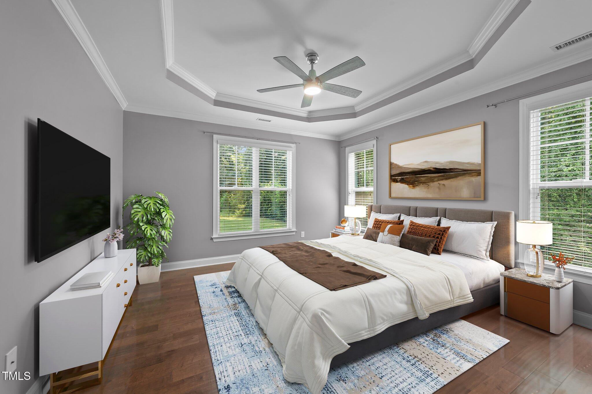 4125 Olde Judd Drive Willow Spring, NC 27592 - Photo 18 of 48 a spacious bedroom with a large bed and a flat screen tv