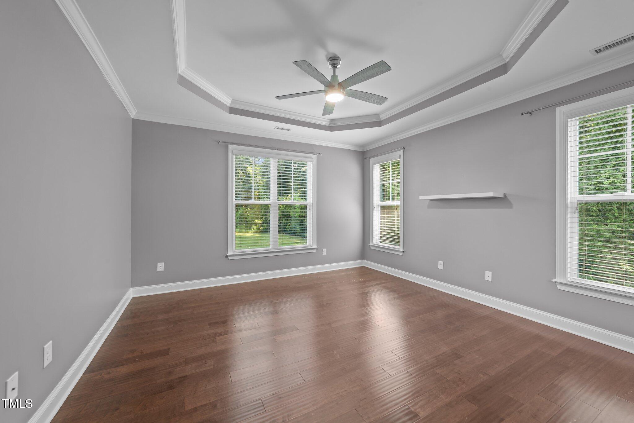 4125 Olde Judd Drive Willow Spring, NC 27592 - Photo 19 of 48 a view of an empty room with wooden floor and a window