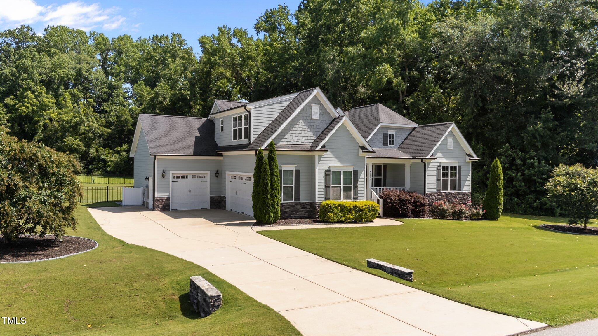 4125 Olde Judd Drive Willow Spring, NC 27592 - Photo 2 of 48 a front view of a house with a yard