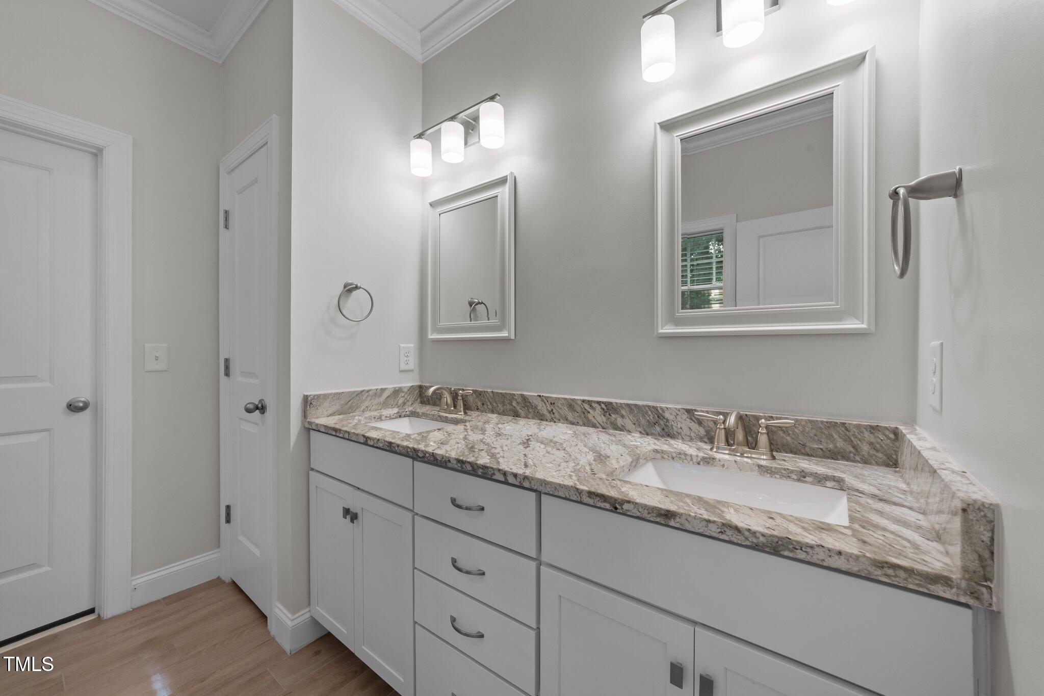 4125 Olde Judd Drive Willow Spring, NC 27592 - Photo 21 of 48 a bathroom with a granite countertop double vanity sink and mirror