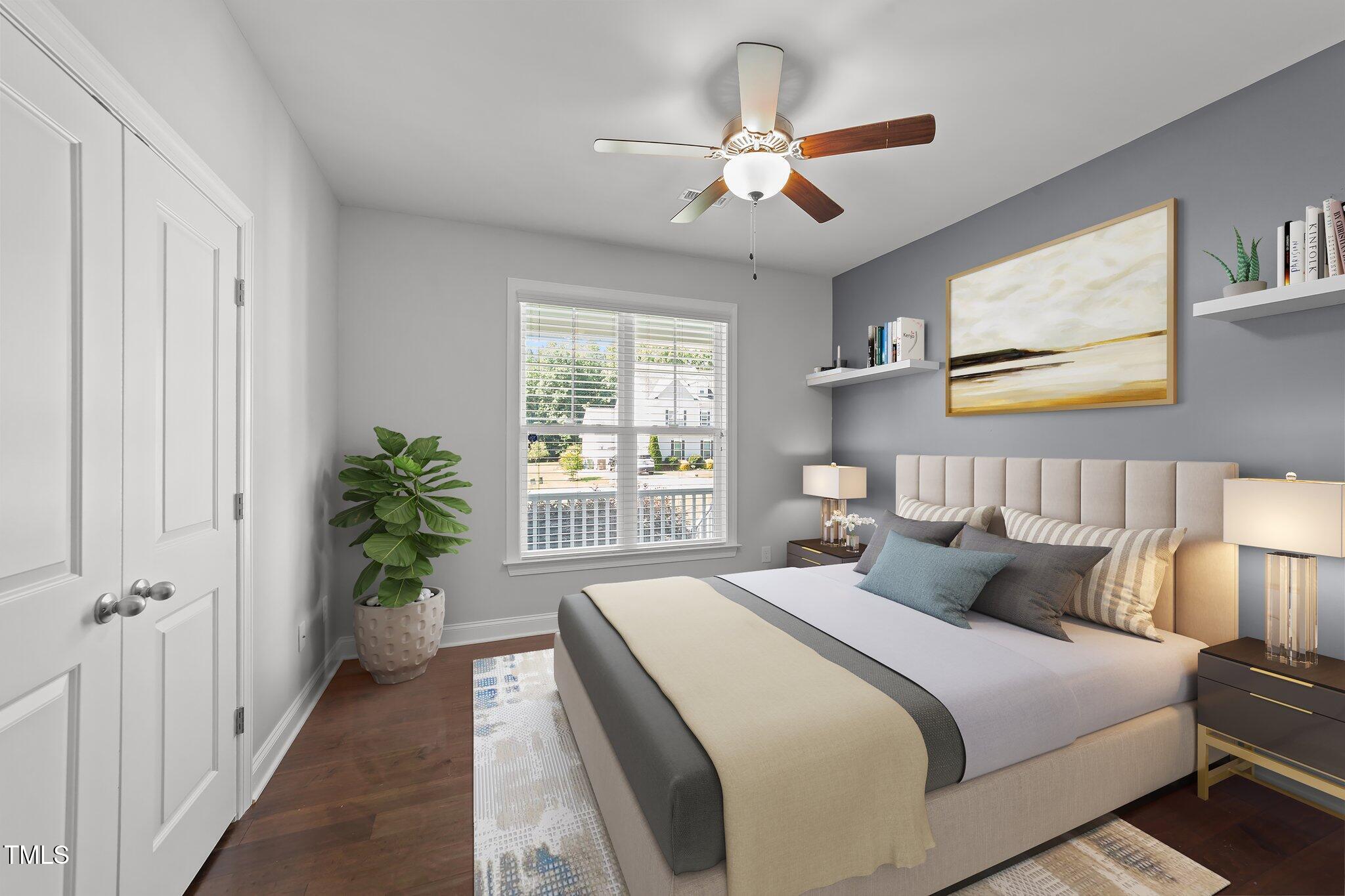 4125 Olde Judd Drive Willow Spring, NC 27592 - Photo 24 of 48 a bedroom with a large bed and a chandelier
