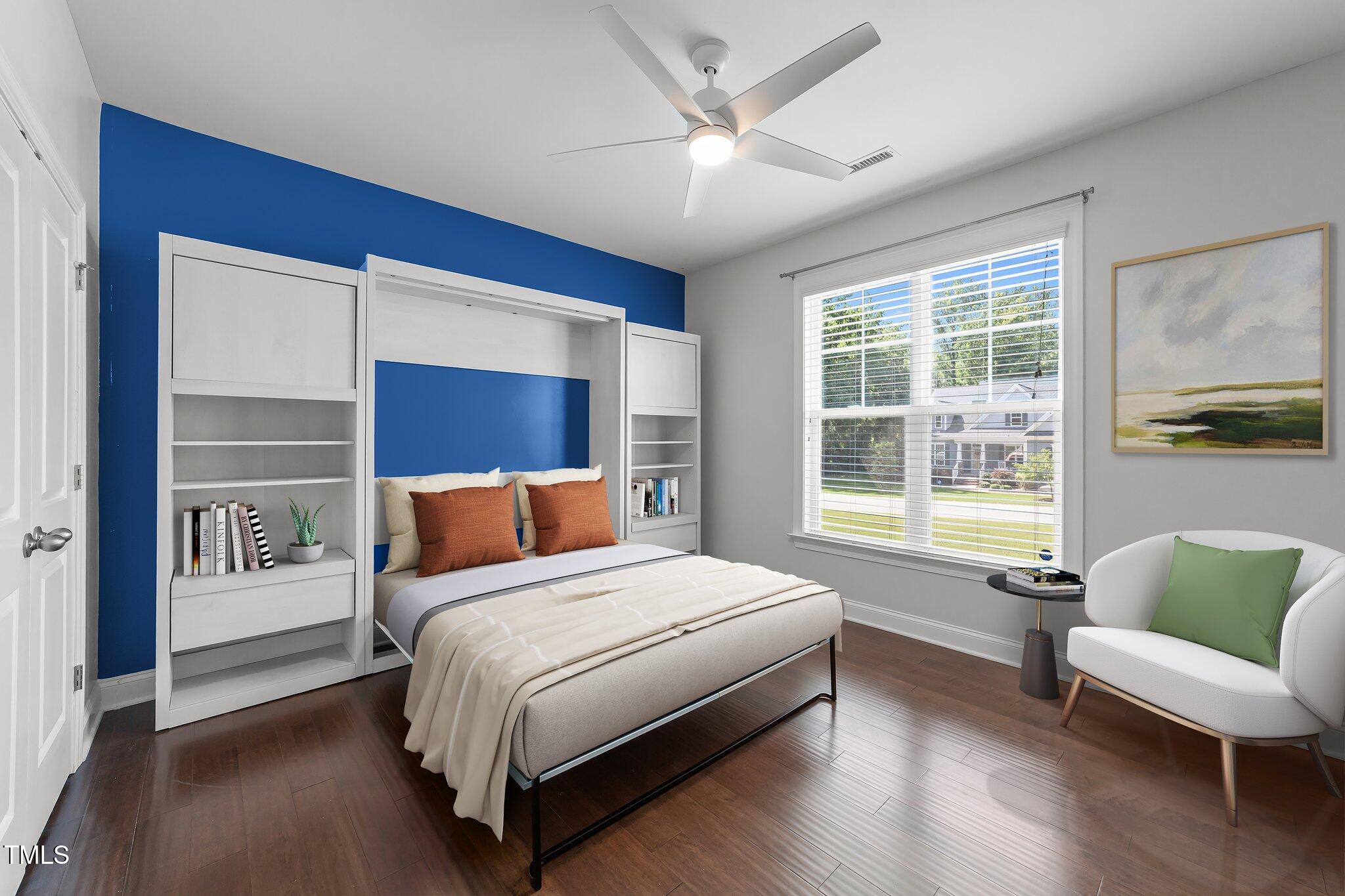 4125 Olde Judd Drive Willow Spring, NC 27592 - Photo 28 of 48 a bedroom with a large bed couch and a window
