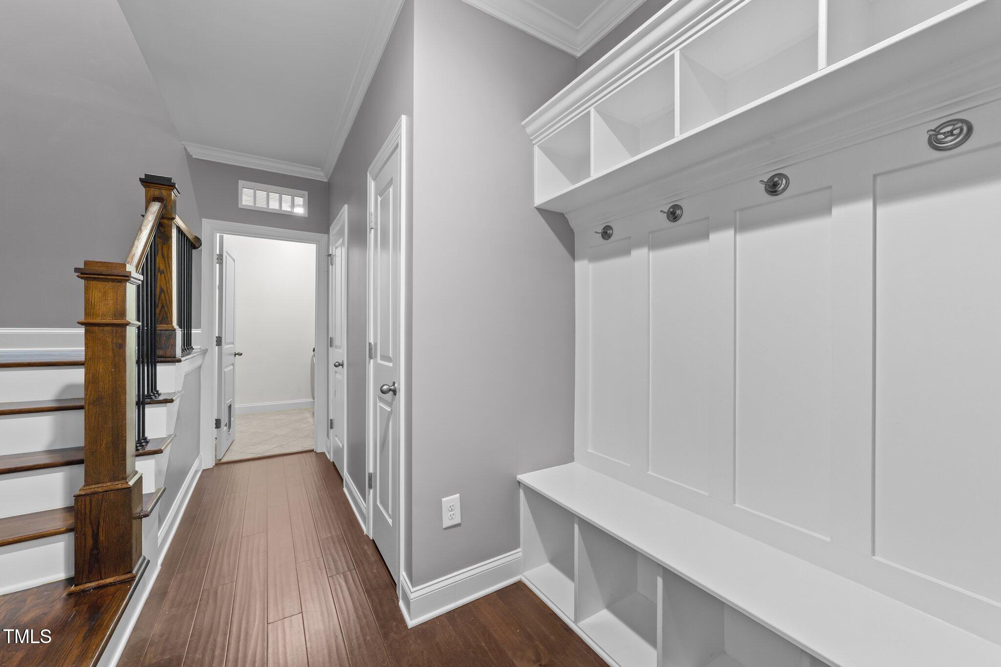4125 Olde Judd Drive Willow Spring, NC 27592 - Photo 31 of 48 a view of a hallway with wooden floor and staircase
