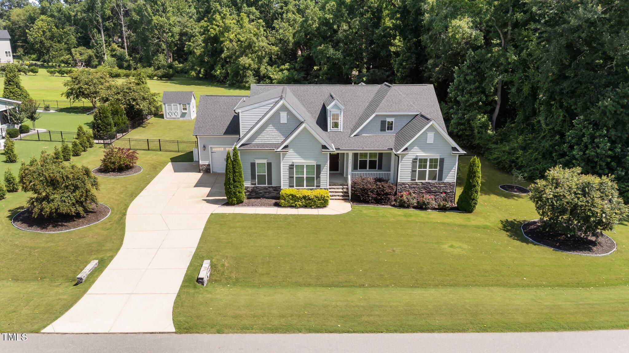 4125 Olde Judd Drive Willow Spring, NC 27592 - Photo 43 of 48 a view of house with garden space and swimming pool