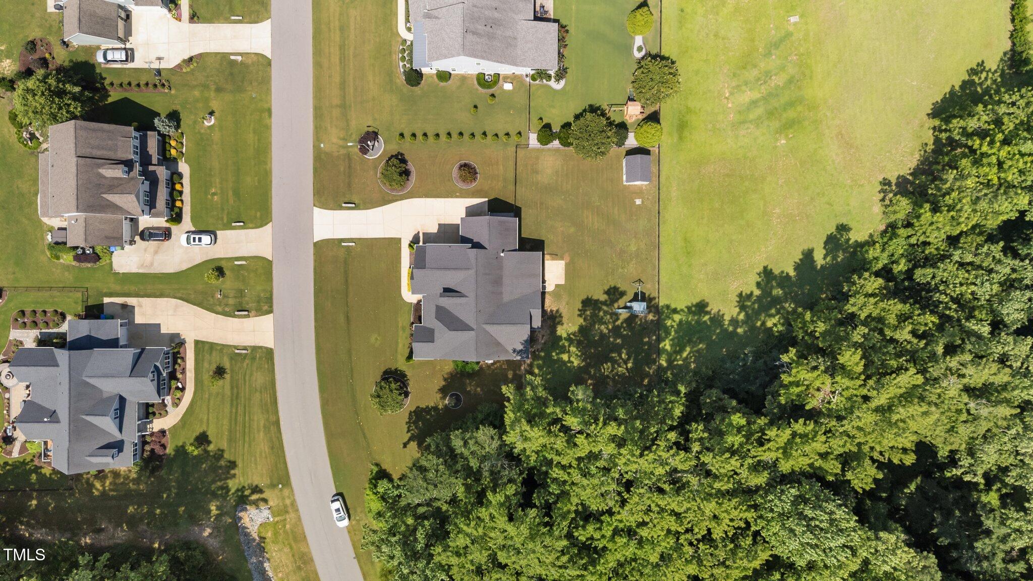 4125 Olde Judd Drive Willow Spring, NC 27592 - Photo 45 of 48 aerial view of a house with a yard
