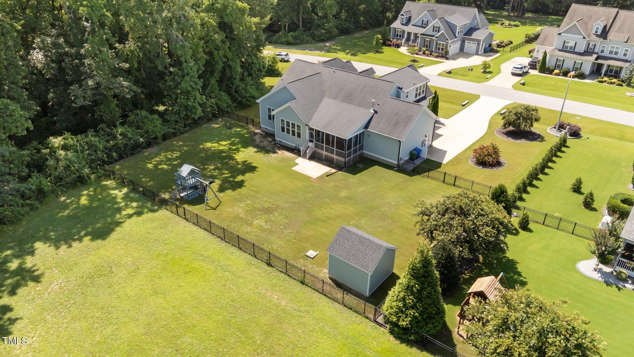4125 Olde Judd Drive Willow Spring, NC 27592 - Photo 46 of 48 an aerial view of a house with a swimming pool